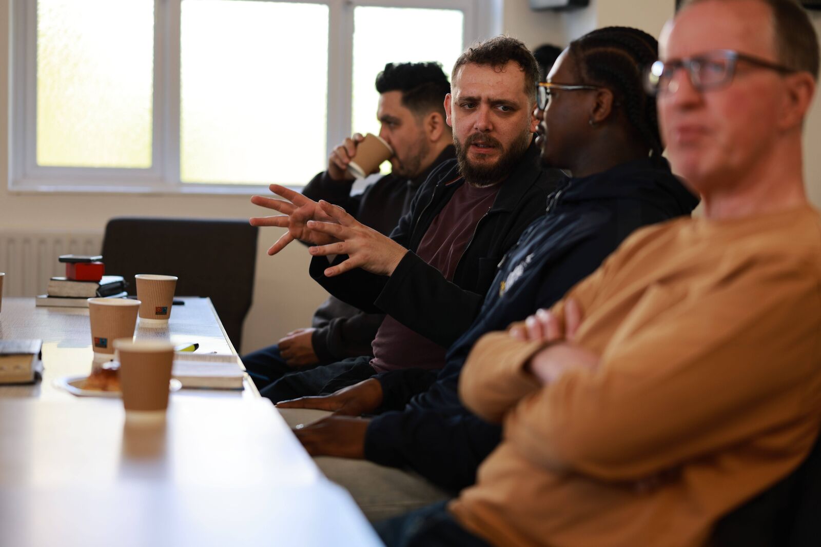 A House Church talking round a table